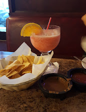 Strawberry margarita with chips and salsa